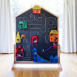 agnetic tiles and road toppers sitting on blackboard of multi-board with stand sitting flush