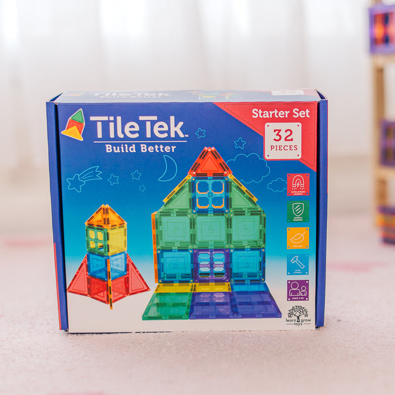 TileTek building block starter set packaging on a light surface with a blurred background