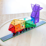 Colourful vehicle made from magnetic tiles sitting on road tile toppers on a table