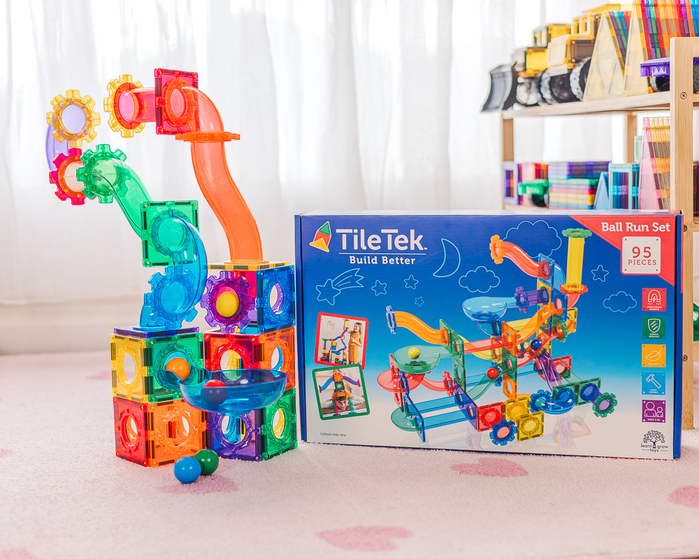 Colourful TileTek ball run set with packaging on a light surface