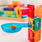 Rainbow coloured magnetic tile ball run with gears and a ball on a white surface