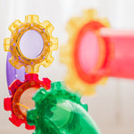 Colorful magnetic ball run tile looking like gears on a white background