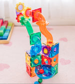 Colourful magnetic building block set on a light surface with a blurred background