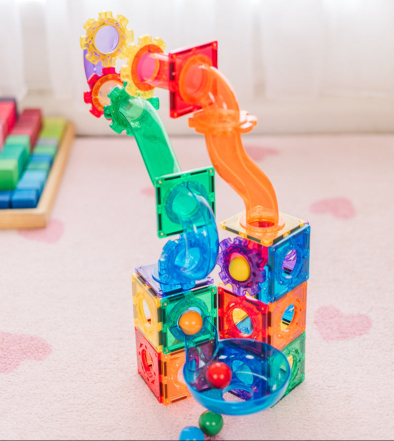 Colourful magnetic building block set on a light surface with a blurred background