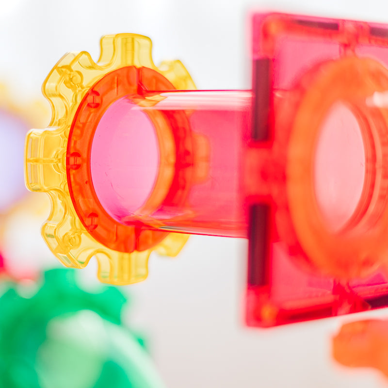 Colourful transparent gears on a white background