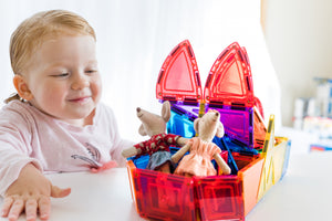 Child playing with dome pack with maileg mice