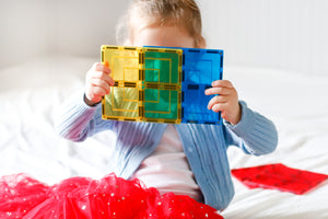 Learn and Grow large square tile pack showing girl holding the yellow and blue tiles