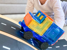 Load image into Gallery viewer, Magnetic truck being pushed by a child up a road track hill
