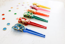 Load image into Gallery viewer, Colourful magnetic wands and metal rimmed counting chips used by children for sensory play
