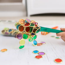 Load image into Gallery viewer, Colourful magnetic wands and metal rimmed counting chips used by children for sensory play

